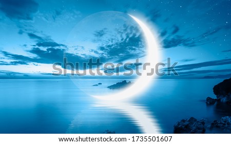 Abstract blue background with crescent moon over the sea,  lot of stars in the background at night  Royalty-Free Stock Photo #1735501607