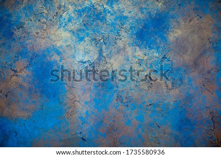 Blue wall background with abstract spots. Beautiful pearly texture, abstract wall surface background, vintage surface texture with copy space, unusual spotty surface.