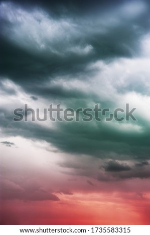 Natural sky composition. Dark ominous colorful storm rain clouds. Dramatic sky. Overcast stormy cloudscape. Thunderstorm. Element of apocalypse design. Toned.