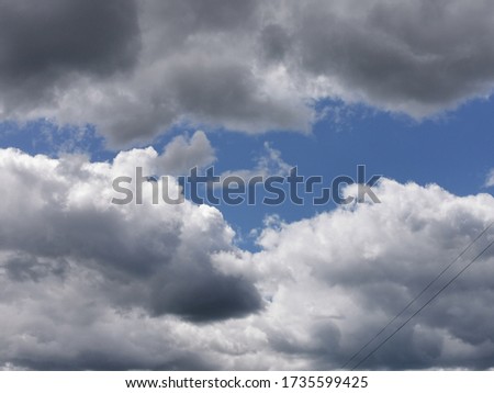 White clouds in a dark blue sky. Photo of clouds 01.