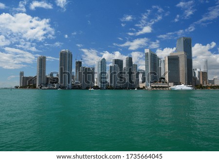 Miami Downtown city skyscrapers waterfront view from sea side.