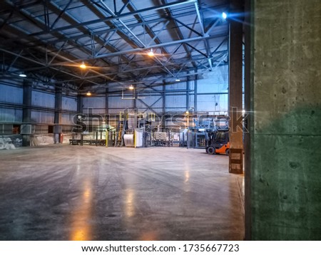 Pallet racks inside a cement plant. Loading shop of a cement plant. Royalty-Free Stock Photo #1735667723