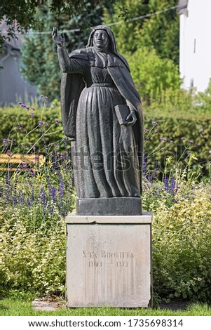 Vadstena, Sweden. Statue of St. Bridget, the founder of the Bridgettines nuns and monks. Vadstena Abbey, founded in 1346 by St. Bridget, is the motherhouse of the Bridgettine Order. Royalty-Free Stock Photo #1735698314