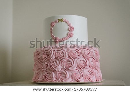 Homemade cake with flower decoration with custom inscription banner