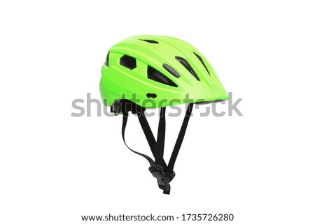 A helmet for riding bicycle or playing skate in green color isolated on white background                                 