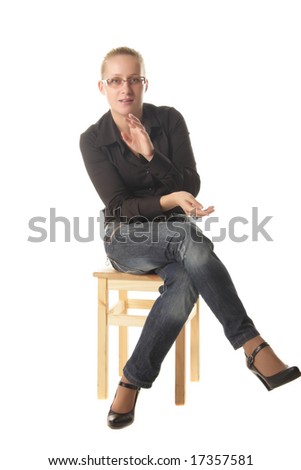 Girl in casual wear sitting on wooden chair and talking isolated