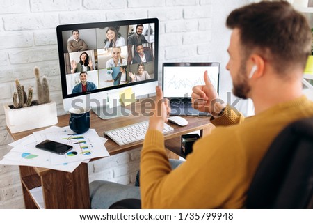 Video conference. Business partners communicate via video using laptop. The guy talks with his business partners appearance about plans and strategy. Distant work Royalty-Free Stock Photo #1735799948
