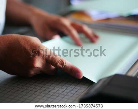 Focussing in finger man hands holding blank paper 