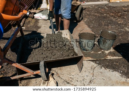 Work with cement mortar, pouring cement mortar wall, foundation and floor.