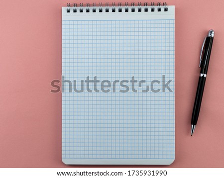 open white Notepad with a pen
