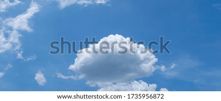 Panorama of bright blue sky with white clouds floating in a wide view during the day without the sun