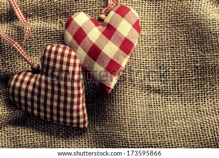 On canvas textile fabric hearts-wood background