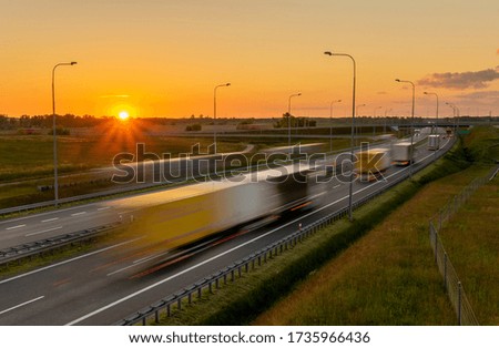 heavy truck traffic on the highway in the evening