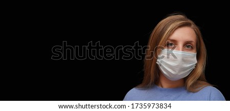 Close up photo of young woman wearing facial medical mask protecting against pandemic. Copy space for your text. Coronavirus outbreak concept. 
