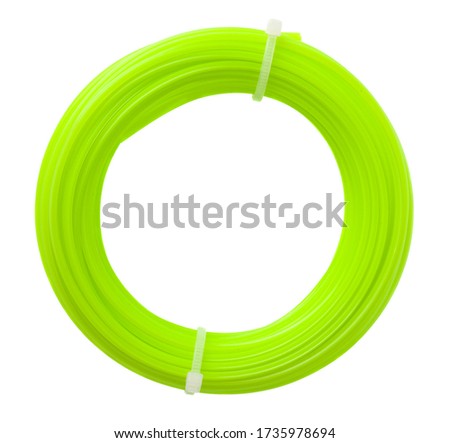 Plastic green string for trimmer isolated on white background close-up.