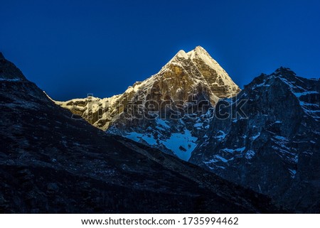 shot taken on May 2017at 5.40am from Gomukh base camp, morning sun rays are reflected by the peaks of Himalayas range.