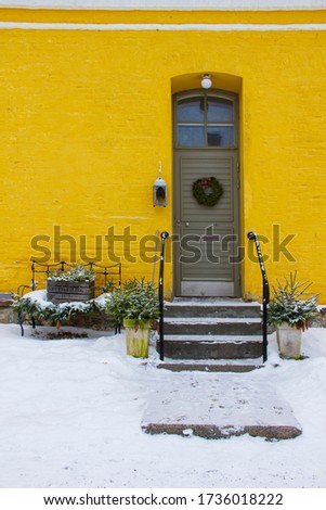 Beautiful doors of wooden buildings in the New Year decoration.