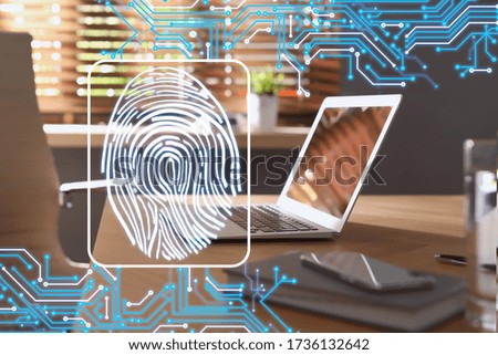 Fingerprint identification. Modern laptop and smartphone on table indoors