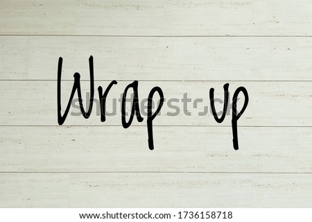 "Wrap up" on the wooden wall background Royalty-Free Stock Photo #1736158718
