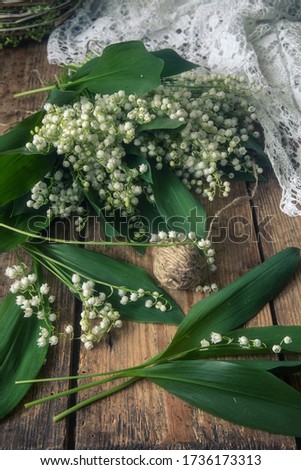 Lily of the valley on a wooden table closeup