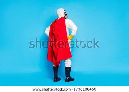 Full body back rear spine view photo confident man doc put hands waist look copyspace ready stop novel covid epidemic spread wear goggles yellow latex gloves isolated blue color background