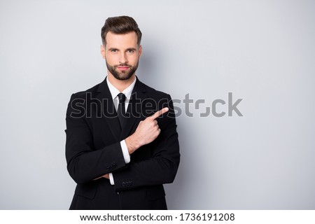 Portrait of confident success man lawyer point index finger copy space present promo wear formalwear outfit isolated over grey color background