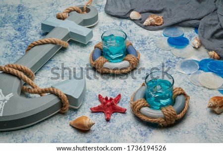 refreshing shot of marine liquor with ice, details and decoration of the sea
