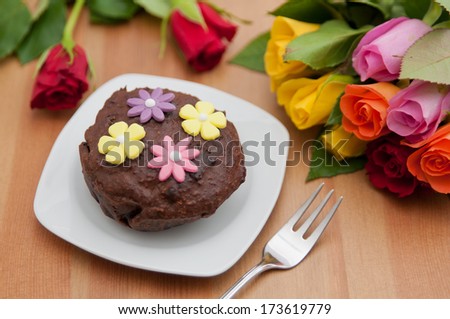 Small chocolate cake with roses for valentines day