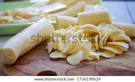Close up of cassava sliced on a cutting board Royalty-Free Stock Photo #1736198624