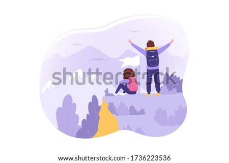Travelling, tourism, nature, mountaineering, hiking concept. Young couple man woman hikers tourists backpackers stand on hill look on mountains. Vacation trip active recreation and extreme lifestyle.