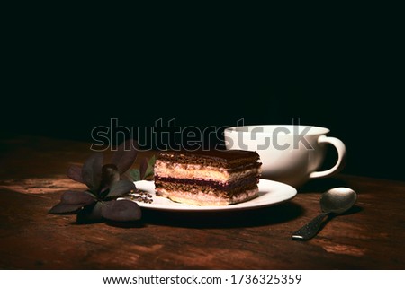 chocolate cake with coffee and a sprig of barberry, a stylish photo for a culinary blog.