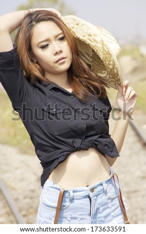 Portrait of a beautiful young asian female on railway , train