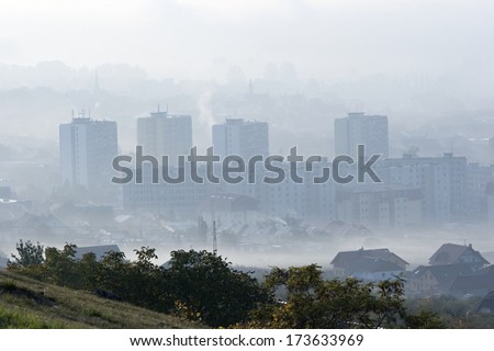 City and landscape shrouded in smog