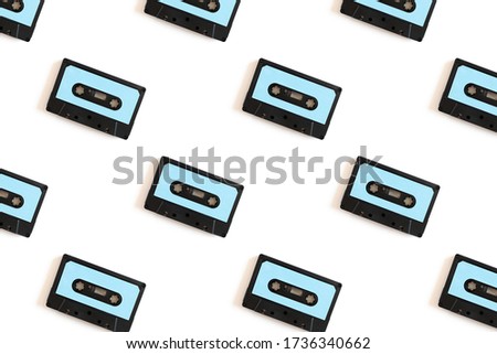 Cassette tapes pattern on a white background. Creative layout.