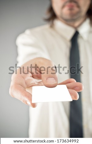 Businessman paying with credit card, selective focus. Blank credit card with copy space for any title or design.