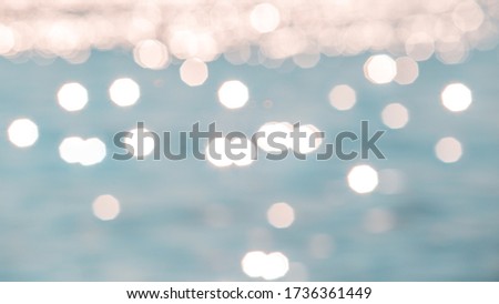 Abstract or blurry image of glitter water of sea or ocean for background usage.