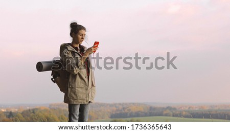 Hiker Woman taking photo smartphone photographing scenic landscape nature background view Hipster girl enjoying vacation travel adventure