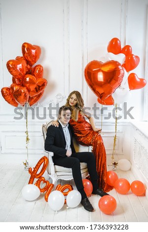 stylish couple man and woman with balloons for Valentine's day.