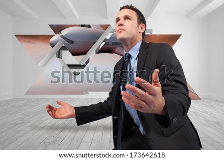 Businessman posing with arms out against digitally generated room with picture frames