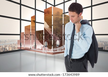 Serious businessman holding his jacket against room with large window showing city