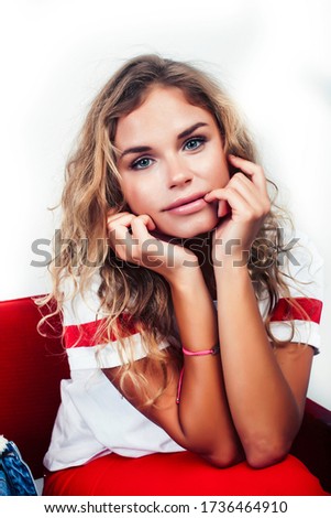 young pretty teenage hipster girl posing emotional happy smiling on white background, lifestyle people concept