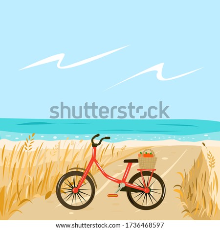 Red Bicycle on the beach by the sea with a basket of apples