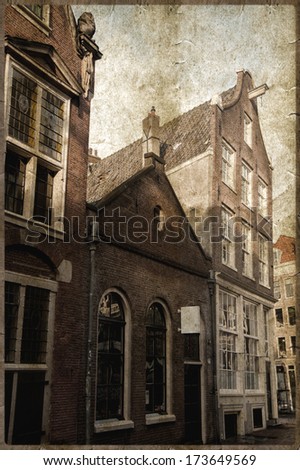 Vintage photo of aged buildings in Amsterdam country