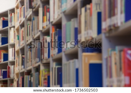 Books, library. Background for education. Blurred shot.