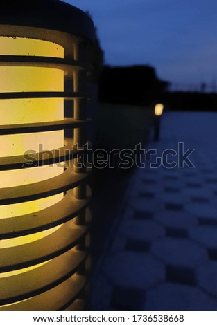 the lantern illuminates the courtyard in the dark