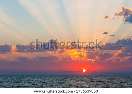 beautiful sunset on the sea, sun and rays