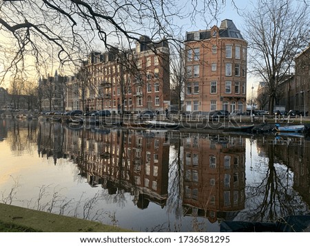 Euro winter in Amsterdam channel reflection.
