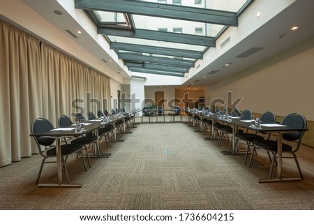 Interior of a conference room with glass window ceiling in a modern hotel