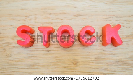 letter stock on wood background