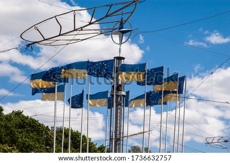 Flagpoles with flags on the European square in Kyiv 